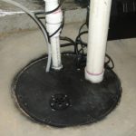 Sump pump with drain in cover