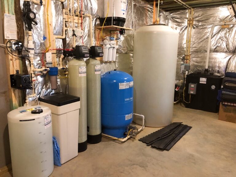 A Solution Feeder, A Water Softener, A Sediment Filter, A Birm Tank, A Pressure Tank, A Reverse Osmosis, A Storage Tank And A Radon Remediation System With A Water Pressure Booster