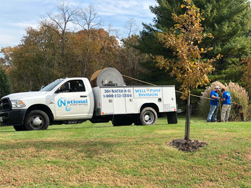 National water service truck and employees