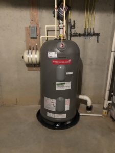 a Marathon Gas Water Heater with a leak protection pan and an expansion tank