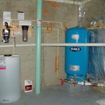 A Solution Feeder and Solution Tank for pH and corrosion control, a Whole House Sediment Filter and a Pressure Tank