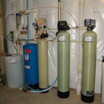 A Solution Feeder Pump and Solution Tank for pH and corrosion control, a Whole House Sediment Filter, a Pressure Tank, a Mixer Tank, a Water Softener and Brine Tank for hard water and an Iron Breaker