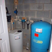 A Solution Feeder Pump and Solution Tank for pH and corrosion control, a Whole House Sediment Filter and a Pressure Tank