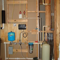 A Constant Water Pressure System, a Whole House Sediment Filter, a Mixing Tank and a Ultraviolet Light for the disinfection of bacteria and virus' in water