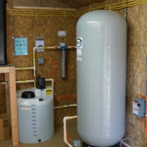 An extra large Solution Tank and Solution Feeder Pump for pH and corrosion control, a Whole House Sediment Filter and a Pressure Tank