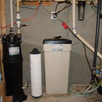 An Irrigation Sediment Filter, a Water Softener and a Brine Tank and a post treatment Sediment Filter