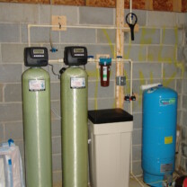 a water softener, an acid neutralizer, a sediment filter and a pressure tank