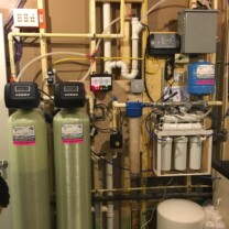 an acid neutralizer, a water softener, a sediment filter, a constant pressure system, a pipe burst pro and a reverse osmosis