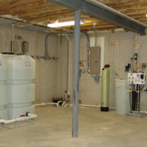 Two Water Storage Tanks, a Sump Pump, Acid neutralizers for pH and corrosion control, Solution Feeders Pumps and Solution Tanks, And a Whole House Reverse Osmosis