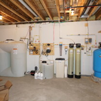 A Water Storage Tank with Pressure Booster Pump, a Solution Feeder for pH & corrosion control, an Ultra-Violet System to remove all bacteria from water, a Whole House Sediment Filter, a Water Softener with Brine Tank for hard water, a Carbon Tank for odor, smell and remediation of low levels of radon, a Well Water Pressure Tank with Pump Protection Control Center and a Reverse Osmosis System for 99.9% contaminant free cooking & drinking water