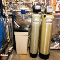 a sediment filter, a water softener and a chemical feeder
