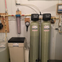 a water softener, an acid neutralizer and a sediment filter