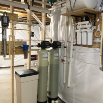 an ultraviolet bacteria disinfection light, a sediment filter, a water softener, a multi media tank, a sump pump and a reverse osmosis