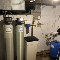 a water softener, an acid neutralizer and a pressure tank
