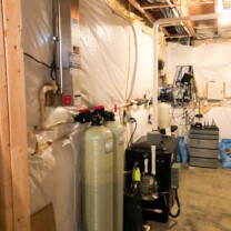 an ultraviolet light for bacteria disinfection, twin carbon tanks, a radon remediation system with a water pressure booster