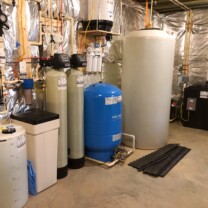 a Solution feeder, a water softener, a sediment filter, a birm tank, a pressure tank, a reverse osmosis, a storage tank and a radon remediation system with a water pressure booster