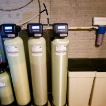 a pressure tank, a nitrate removal tank, a water softener, an acid neutralizer and a sediment filter