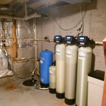 a sump pump, a pressure tank, a nitrate removal tank, a water softener, an acid neutralizer and a sediment filter