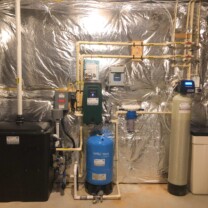 a radon remediation system with a water pressure booster, a constant water pressure system, a sediment filter and a water softener