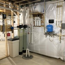 an ultraviolet bacteria disinfection light, a sediment filter, a water softener, a multi media tank, a sump pump, a reverse osmosis and a constant pressure system