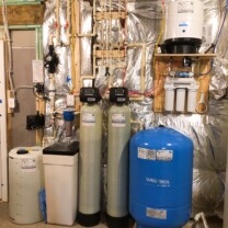 a Solution feeder, a water softener, a sediment filter, a birm tank, a pressure tank and a reverse osmosis