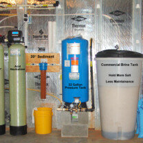an ultraviolet disinfection light, a water softener an acid neutralizer, a sediment filter and a pressure tank