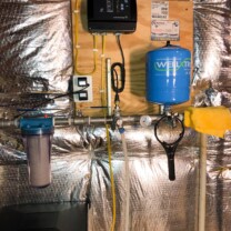a sediment filter and a constant pressure system