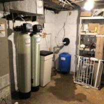 a water softener, an acid neutralizer and a pressure tank