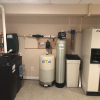 a radon remediation system with a water pressure booster, a Solution feeder, a water softener and a sediment filter