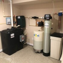 a radon remediation system with a water pressure booster, a Solution feeder, a water softener and a sediment filter