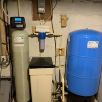 Pressure tank, water softener for hard water and a sediment filter
