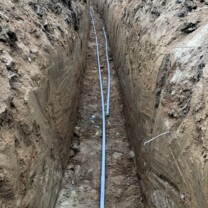 Trench, pipe and wire for a new well pump
