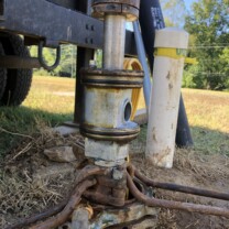 Spool pitless