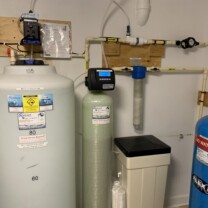 A solution feeder, water softener, sediment filter and a pressure tank.