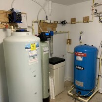 a solution feeder, a water softener, a sediment filter and a water pressure tank