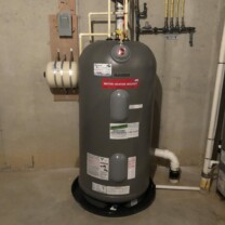 a Marathon Gas Water Heater with a leak protection pan and an expansion tank