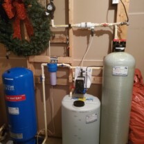 Pressure tank, a sediment filter, a solution feeder and a carbon tank