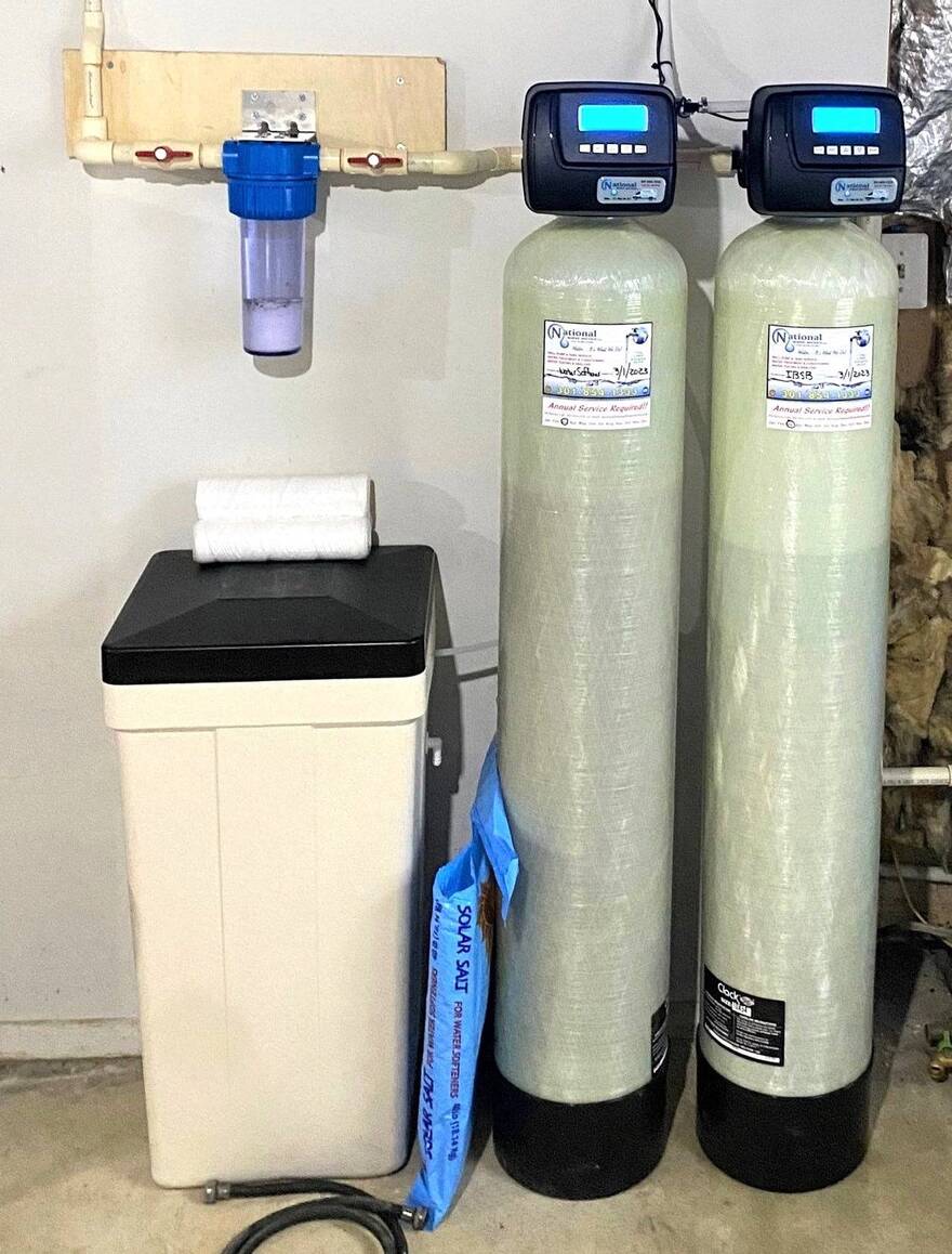 Professional salt-based water softener installation by National Water Service in a Maryland home.
